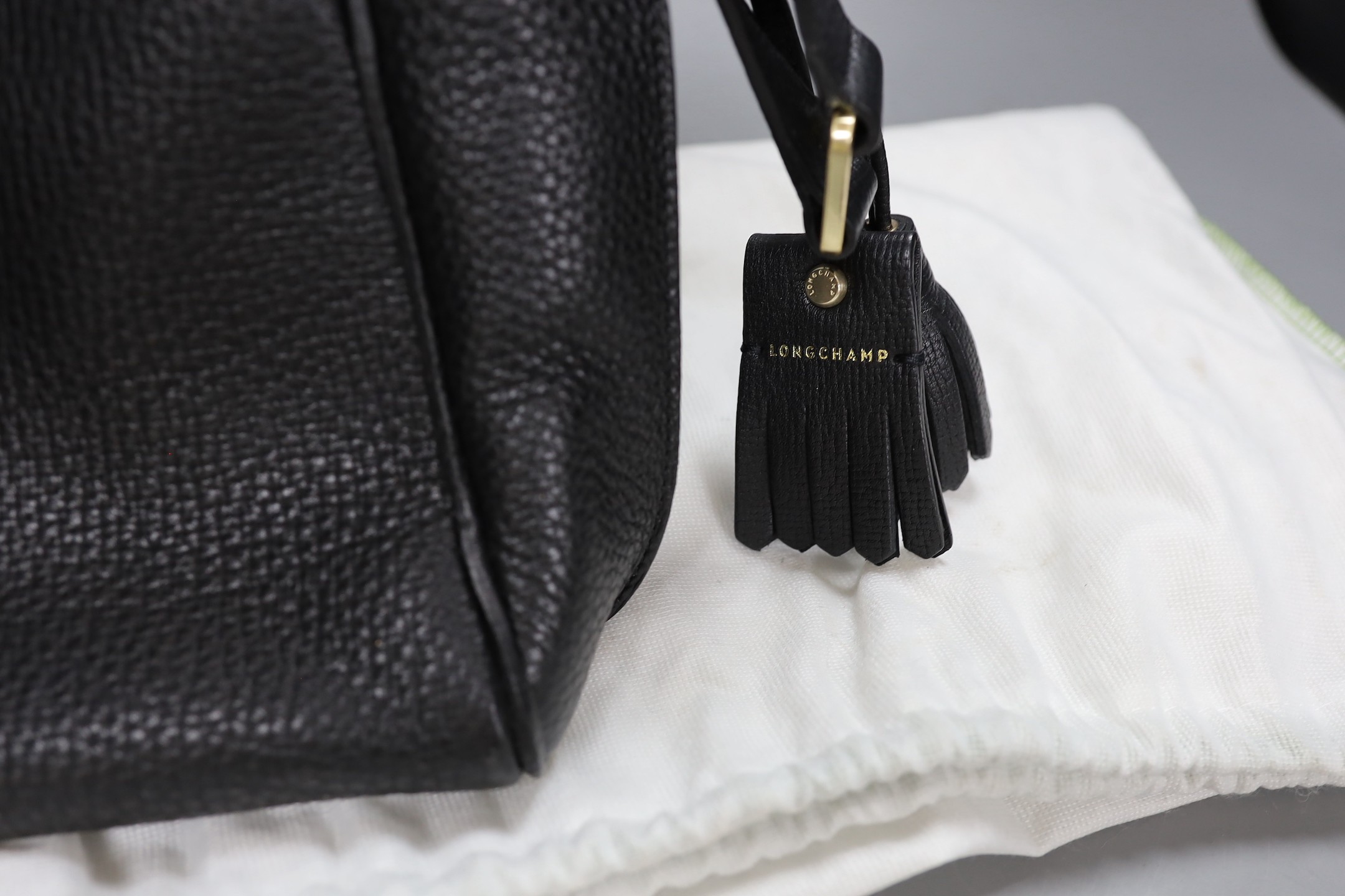 A black leather Longchamp shoulder bag with dust bag, 35 cms wide x 21 cms high